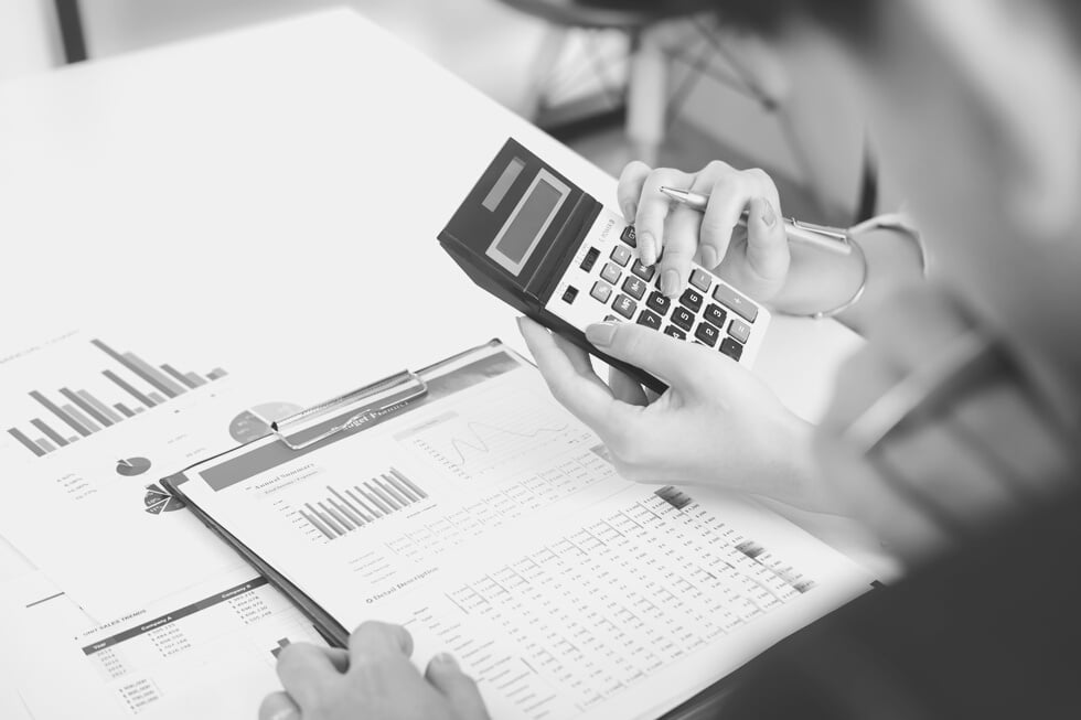 Businesspeople Calculating Data